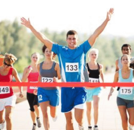 runner crossing the finish line
