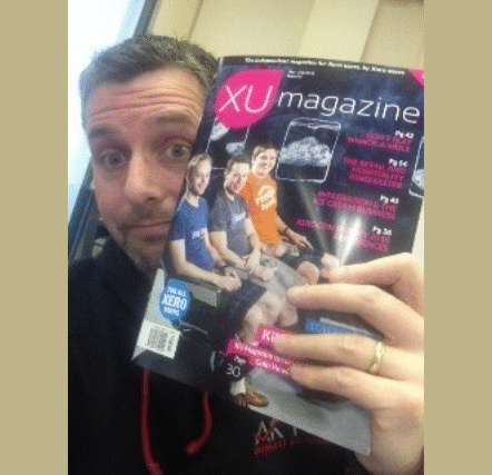 man holding a magazine