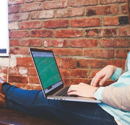 self-employed girl working on laptop