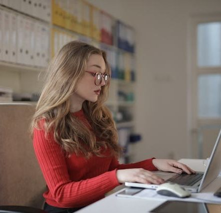 Focused Woman working using Laptop