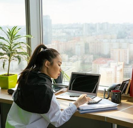 A Woman Working on the Window Counter