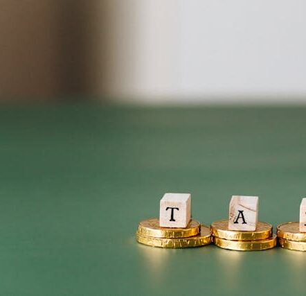 Tax Word on Top of Gold Coins
