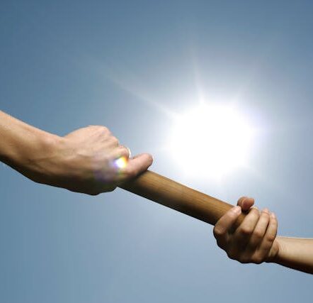 People Passing a Baton