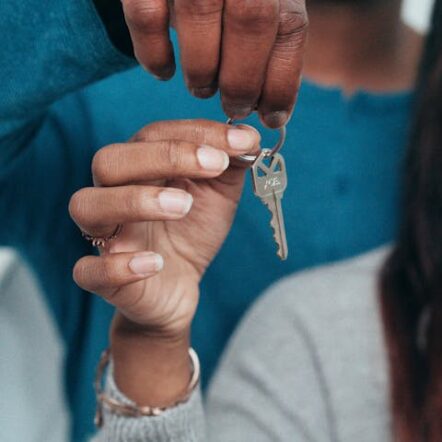People Holding a Key